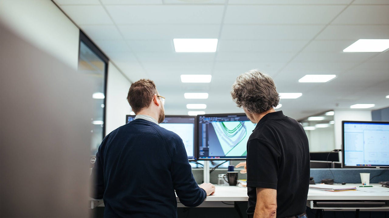 mta two people in front of the software eplan electric p8 